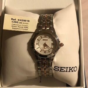 Seiko Silver and Gold Watch with Round white face cabochon crown 50mm water resi